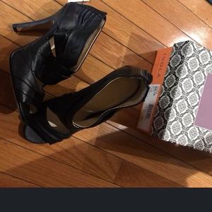 Black, soft leather shoes, heels; named “Balta”